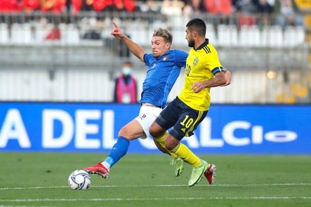 Matteo Lovato of Italy pokes the ball away from Rami Hajal of Sweden during the 2022 UEFA European Under-21 Championship Qualifier match between...
