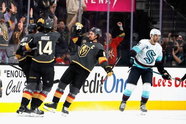 Max Pacioretty, Nicolas Hague and Mark Stone of the Vegas Golden Knights celebrate a first period goal by Pacioretty against the Seattle Kraken...