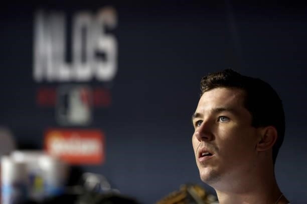 Walker Buehler of the Los Angeles Dodgers looks on from the dugout against the San Francisco Giants during the fifth inning in game 4 of the National...