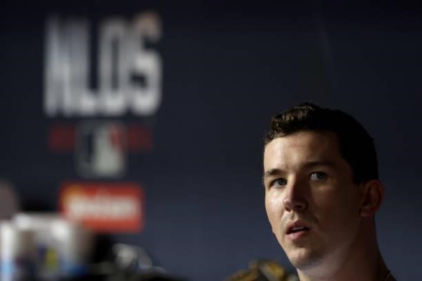 Walker Buehler of the Los Angeles Dodgers looks on from the dugout against the San Francisco Giants during the fifth inning in game 4 of the National...