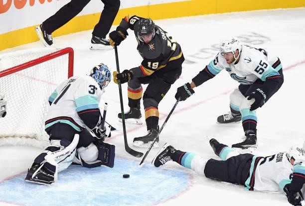 Philipp Grubauer and Jeremy Lauzon of the Seattle Kraken defend against Reilly Smith of the Vegas Golden Knights during the first period of the...