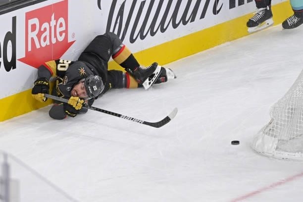 Chandler Stephenson of the Vegas Golden Knights attempts a backhand shot as he crashes into the boards during the first period of a game against the...