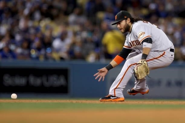 Brandon Crawford of the San Francisco Giants makes a play against the Los Angeles Dodgers during the fourth inning in game 4 of the National League...