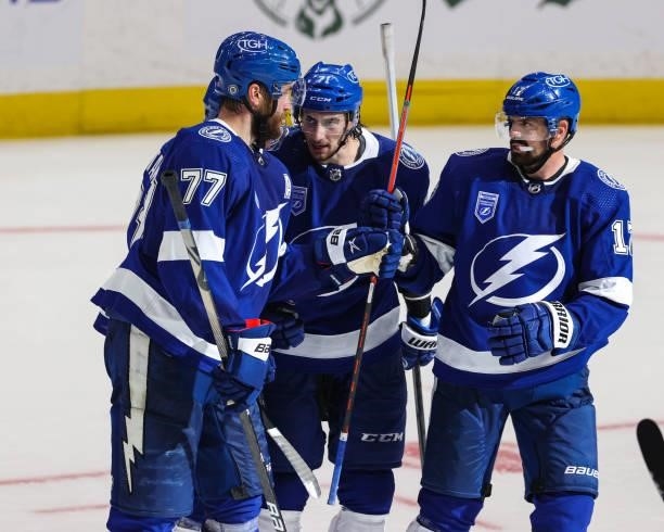 Victor Hedman, Anthony Cirelli and Alex Killorn of the Tampa Bay Lightning celebrate a goal against the Pittsburgh Penguins at Amalie Arena on...