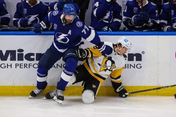 Victor Hedman of the Tampa Bay Lightning skates against Brian Dumoulin of the Pittsburgh Penguins at Amalie Arena on October 12, 2021 in Tampa,...