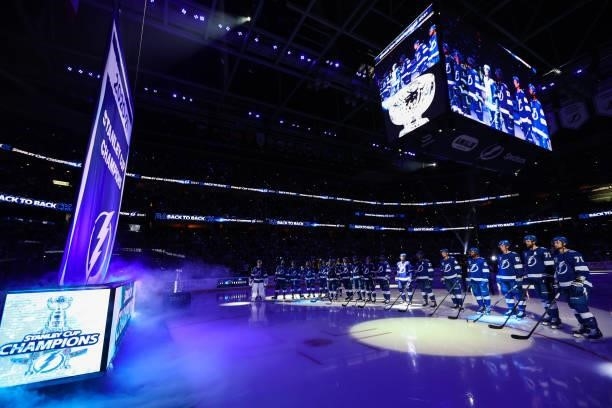 The Tampa Bay Lightning watch the banner rise to the rafters before the game against the Pittsburgh Penguins at Amalie Arena on October 12, 2021 in...