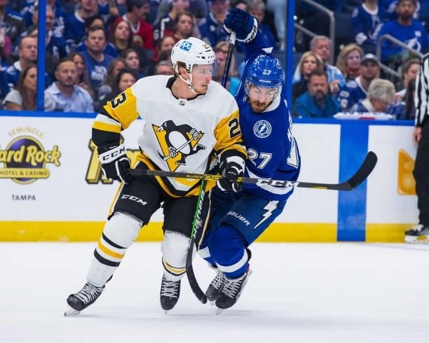 Ryan McDonagh of the Tampa Bay Lightning skates against Brock McGinn of the Pittsburgh Penguins during the first period at Amalie Arena on October...