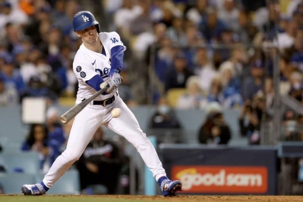 Walker Buehler of the Los Angeles Dodgers hits the ball against the San Francisco Giants during the fourth inning in game 4 of the National League...