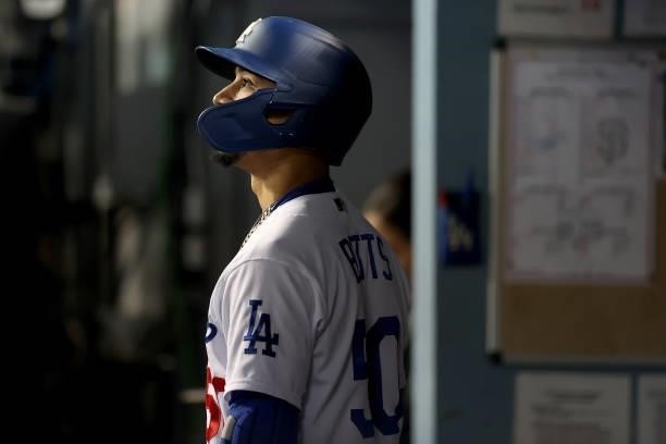 Mookie Betts of the Los Angeles Dodgers looks on from the dugout against the San Francisco Giants during the sixth inning in game 4 of the National...