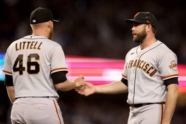 Darin Ruf and Zack Littell of the San Francisco Giants after a single from Trea Turner of the Los Angeles Dodgers during the sixth inning in game 4...