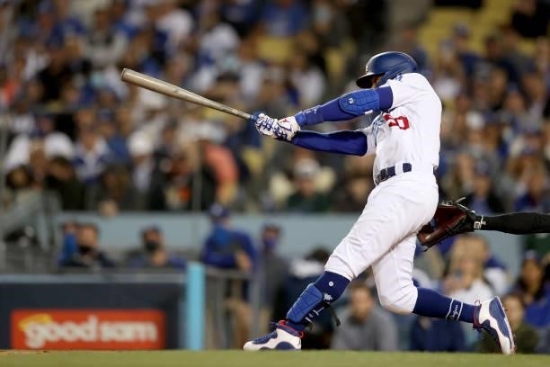 Mookie Betts of the Los Angeles Dodgers watches his single against the San Francisco Giants during the second inning in game 4 of the National League...