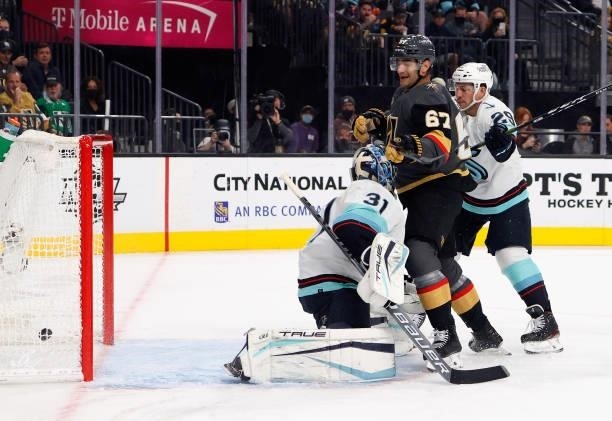 Max Pacioretty of the Vegas Golden Knights deflects a shot by teammate Nicolas Hague past Philipp Grubauer of the Seattle Kraken for a second-period...