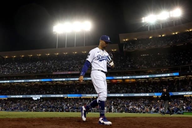 Mookie Betts of the Los Angeles Dodgers walks to the dugout against the San Francisco Giants after the seventh inning in game 4 of the National...
