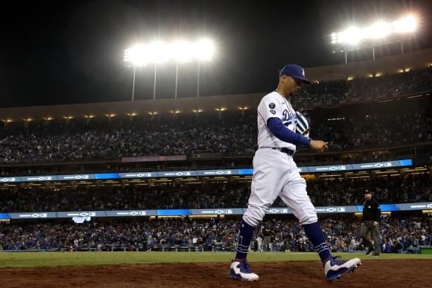 Mookie Betts of the Los Angeles Dodgers walks to the dugout against the San Francisco Giants after the seventh inning in game 4 of the National...