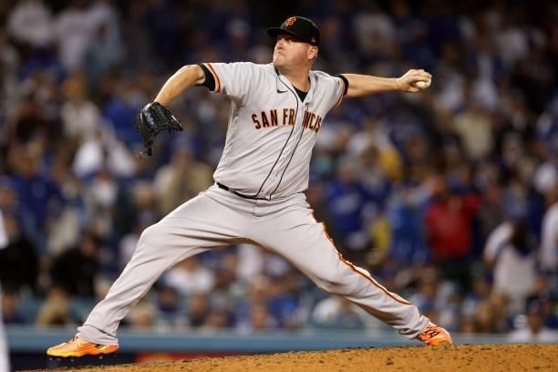 Jake McGee of the San Francisco Giants pitches against the Los Angeles Dodgers during the eighth inning in game 4 of the National League Division...