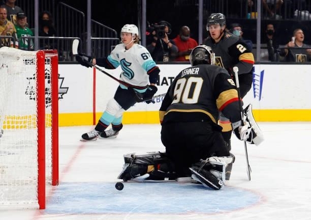 Morgan Geekie of the Seattle Kraken scores against Robin Lehner of the Vegas Golden Knights at 7:58 of the third period of the Kraken's inaugural...