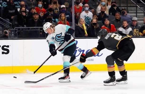 Morgan Geekie of the Seattle Kraken shoots a goal as Zach Whitecloud of the Vegas Golden Knights defends at 7:58 of the third period of the Kraken's...