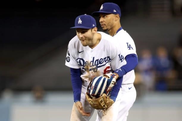 Trea Turner and Mookie Betts of the Los Angeles Dodgers react after the final out to beat the San Francisco Giants 7-2 in game 4 of the National...