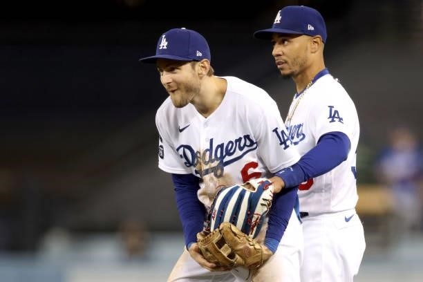 Trea Turner and Mookie Betts of the Los Angeles Dodgers react after the final out to beat the San Francisco Giants 7-2 in game 4 of the National...