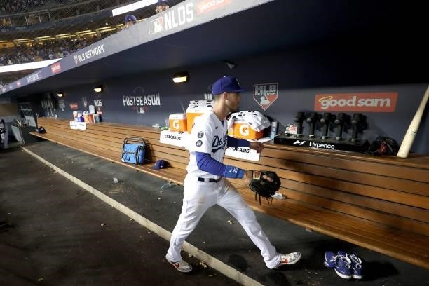 Cody Bellinger of the Los Angeles Dodgers walks in the dugout after beating the San Francisco Giants 7-2 in game 4 of the National League Division...