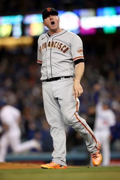 Jake McGee of the San Francisco Giants reacts after giving up a two run home run against the Los Angeles Dodgers during the eighth inning in game 4...