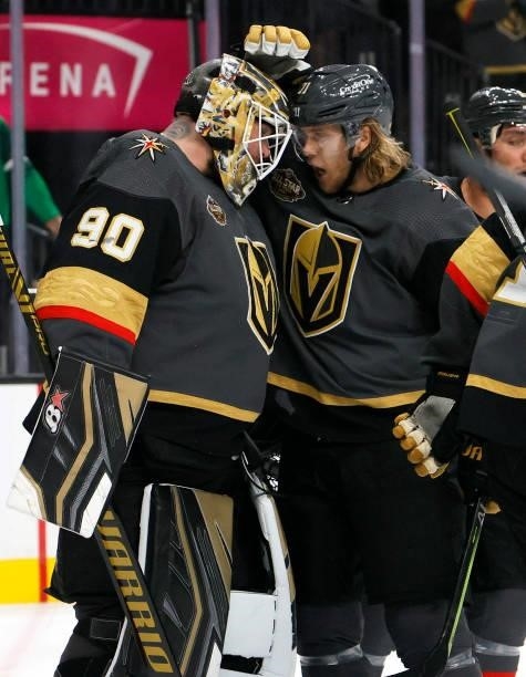 Robin Lehner and William Karlsson of the Vegas Golden Knights celebrate on the ice after the team's 4-3 victory over the Seattle Kraken in the...