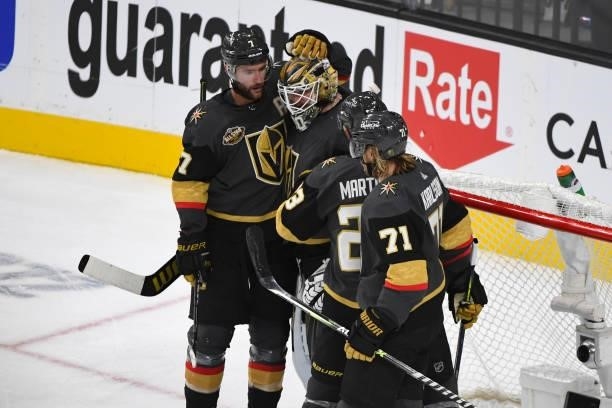 Robin Lehner of the Vegas Golden Knights celebrates with teammates as time expires in their game against the Seattle Kraken in the Kraken's inaugural...