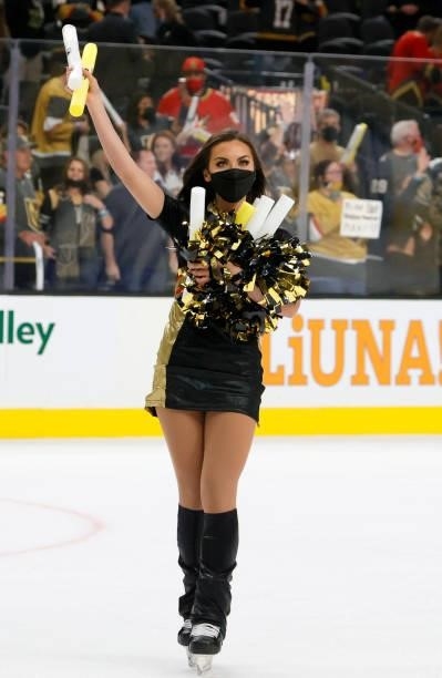 Member of the Knights Guard collects light sticks thrown onto the ice after the Vegas Golden Knights' 4-3 victory over the Seattle Kraken in the...