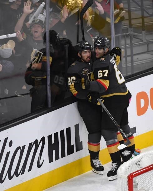 Chandler Stephenson, and Max Pacioretty of the Vegas Golden Knights celebrate Stephenson's game-winning goal against the Seattle Kraken during the...