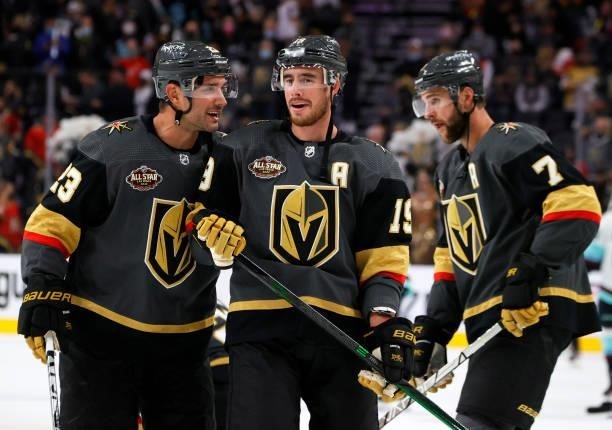 Alec Martinez, Reilly Smith and Alex Pietrangelo of the Vegas Golden Knights warm up before a game against the Seattle Kraken in the Kraken's...