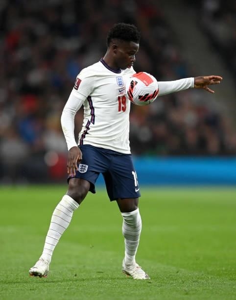 Bukayo Saka of England runs with the ball during the 2022 FIFA World Cup Qualifier match between England and Hungary at Wembley Stadium on October...