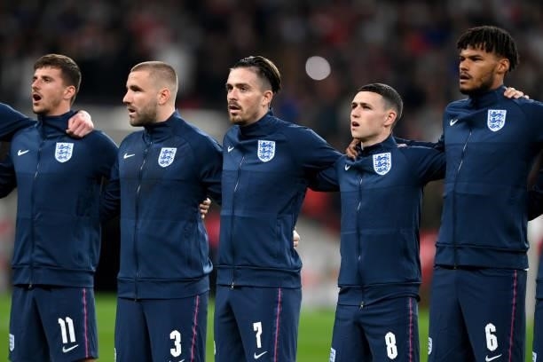 Mason Mount, Luke Shaw, Jack Grealish, Phil Foden and Tyrone Mings of England sing the national anthem prior to the 2022 FIFA World Cup Qualifier...