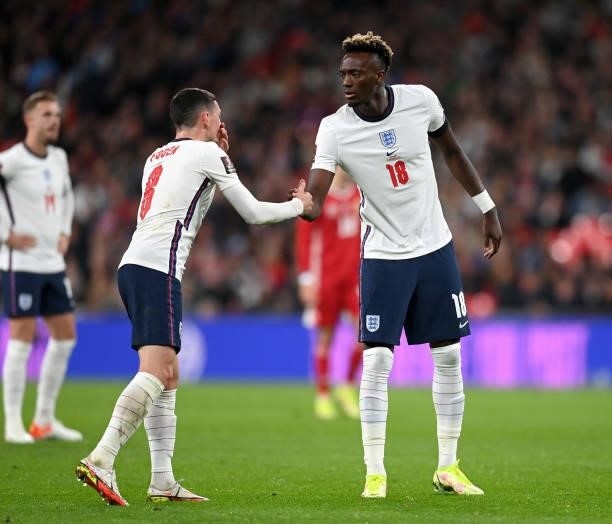 Tammy Abraham of England shakes hands with teammate Phil Foden during the 2022 FIFA World Cup Qualifier match between England and Hungary at Wembley...