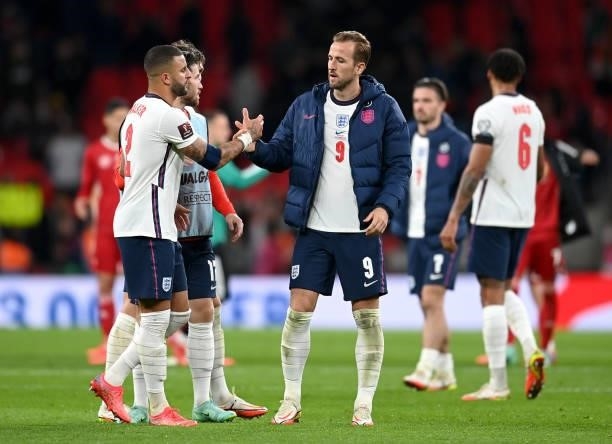 Harry Kane of England shakes hands with teammate Kyle Walker following the 2022 FIFA World Cup Qualifier match between England and Hungary at Wembley...