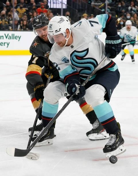 Alex Pietrangelo of the Vegas Golden Knights, skating in his 800th NHL game, knocks the puck away from Joonas Donskoi of the Seattle Kraken, skating...