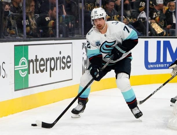 Joonas Donskoi of the Seattle Kraken, playing in his 400th NHL game, skates with the puck against the Vegas Golden Knights in the first period of the...