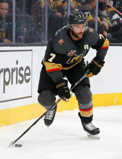 Alex Pietrangelo of the Vegas Golden Knights, playing in his 800th NHL game, skates with the puck against the Seattle Kraken in the third period of...