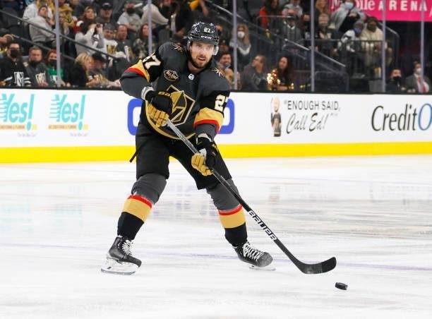 Shea Theodore of the Vegas Golden Knights skates with the puck against the Seattle Kraken in the second period of the Kraken's inaugural...