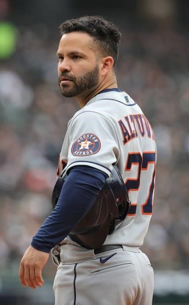 Jose Altuve of the Houston Astros waits at first base during a pitching change by the Chicago White Sox at Guaranteed Rate Field on October 12, 2021...