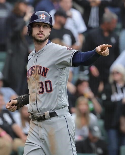 Kyle Tucker of the Houston Astros points to the teammate that drove him in to score a run against the Chicago White Sox at Guaranteed Rate Field on...