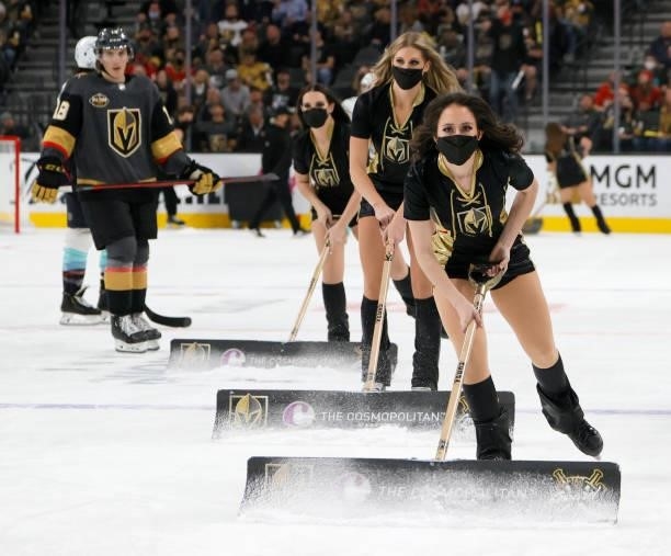 Members of the Knights Guard clean the ice during the Vegas Golden Knights' game against the Seattle Kraken during the Kraken's inaugural...