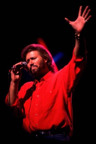 British pop singer Barry Gibb of the group the Bee Gees performs on stage at the Poplar Creek Music Theater, Hoffman Estates, Illinois, July 31, 1989.