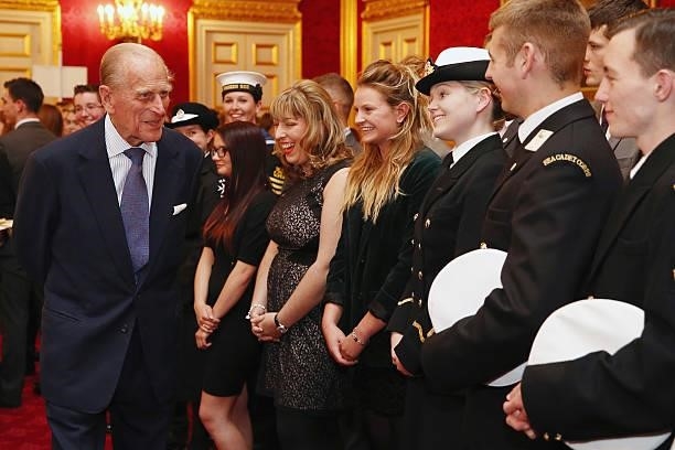 Prince Philip, Duke of Edinburgh speaks with a group of young people during a reception to celebrate the 500th anniversary of his 'Duke of Edinburgh...
