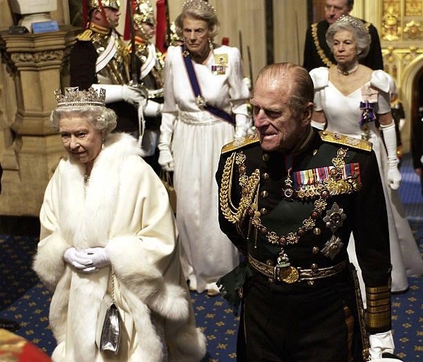 Queen Elizabeth II and Prince Philip the Duke Of Edinburgh arrive at the State Opening of Parliament on November 26, 2003 in London, England.