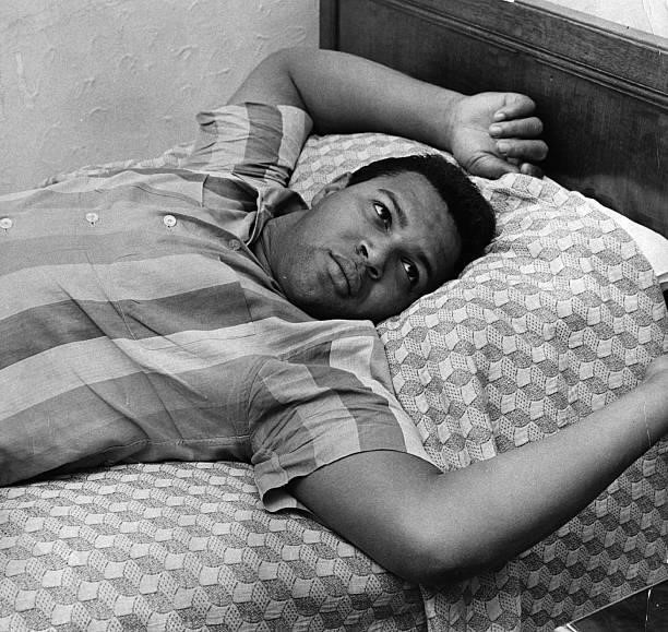 American pop singer Chubby Checker famous for his hit 'The Twist' in 1960, relaxes in a room at the Cumberland Hotel.