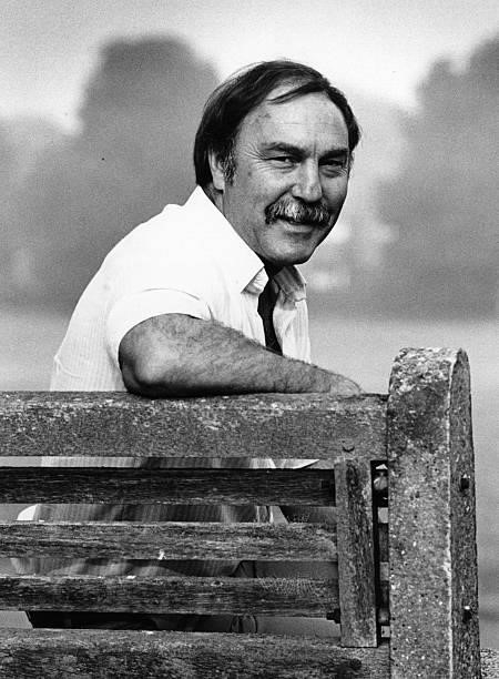 Jimmy Greaves footballer and TV broadcaster relaxing on bench.