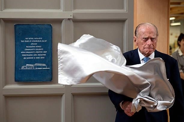 Prince Philip, Duke of Edinburgh, unveils a plaque at the end of his visit to Richmond Adult Community College in Richmond on June 8, 2015 in London,...
