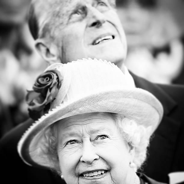Queen Elizabeth II and Prince Philip, Duke of Edinburgh, watch a fly past after arriving at Tegel airport on the first of their four-day visit to...