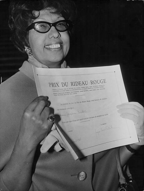 Dancer Josephine Baker holding her award for the 'Red Curtain' prize, in recognition of her achievements in variety, France, April 10th 1968.