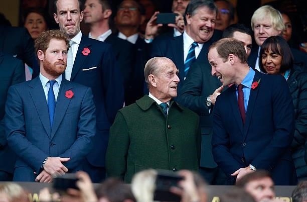 Prince Harry, Prince Phillip and Prince William enjoy the build up to the 2015 Rugby World Cup Final match between New Zealand and Australia at...